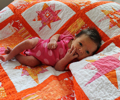 Baby girl and her (guild) quilt