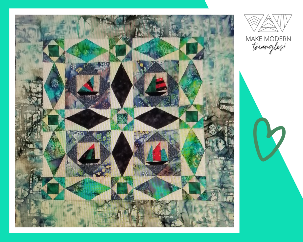 Member spotlight quilt on a traditional quilt block - Storm at Sea -created with bold modern fabrics.