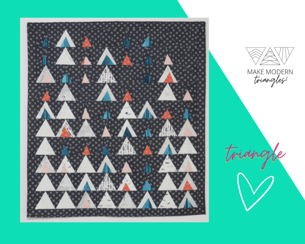 A Make Modern Triangle style quilt made with improvisational blocks made by member.