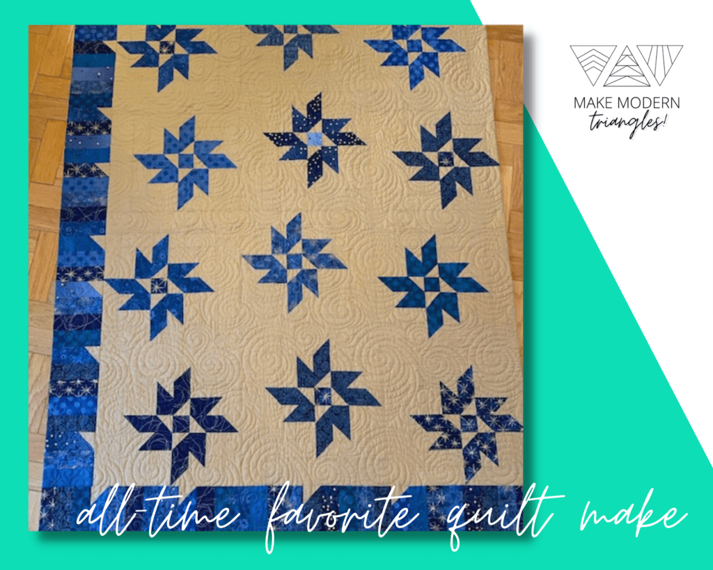 Make Modern Triangles featured member photo of her favorite quilt made with various blues and white fabrics.