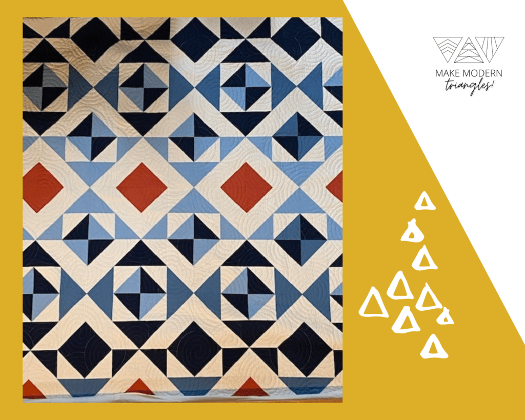 Make Modern Triangles featured member photo of a Red, white and blue quilt made with half square triangles and equilateral triangles.