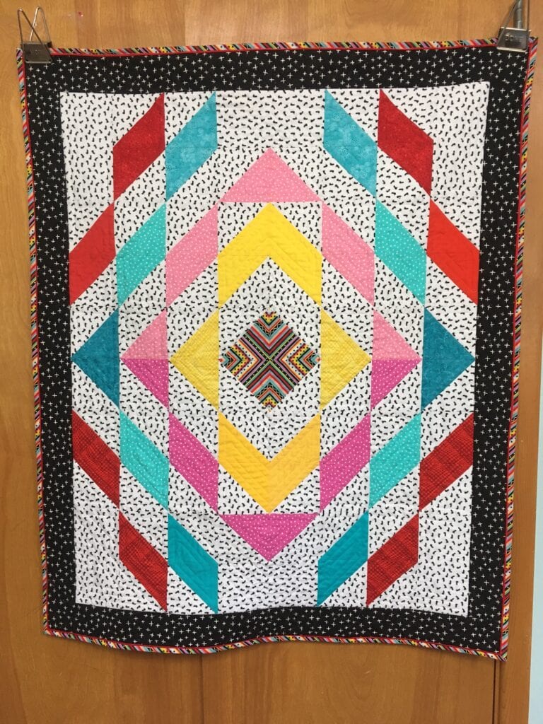 Colorful triangle quilt made by Lonnie W.