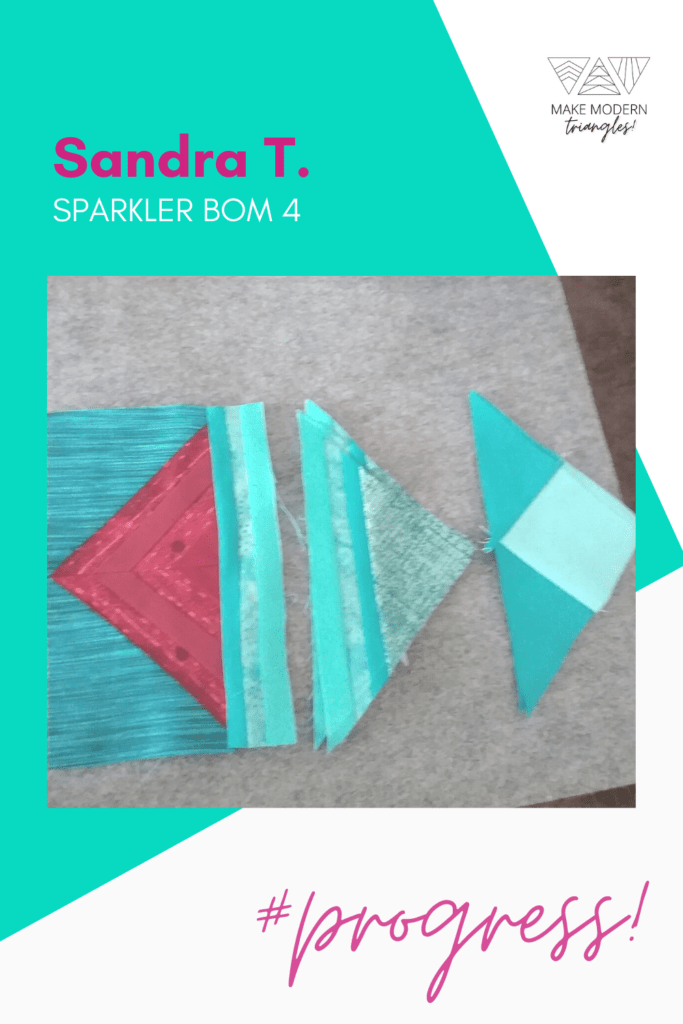 Sparkler BOM month 4 triangle blocks made in red and teal fabrics.