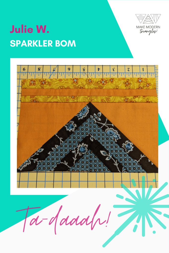 Photo of Make Modern Triangles member's Sparkler BOM blocks made in navy/blue and orange/gold print fabrics.