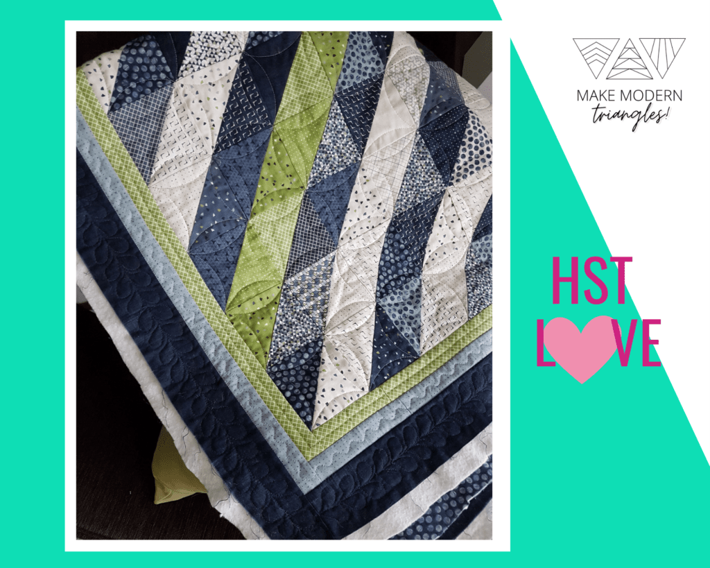 Half square triangle quilts made with green, cream and navy and gray print fabrics.