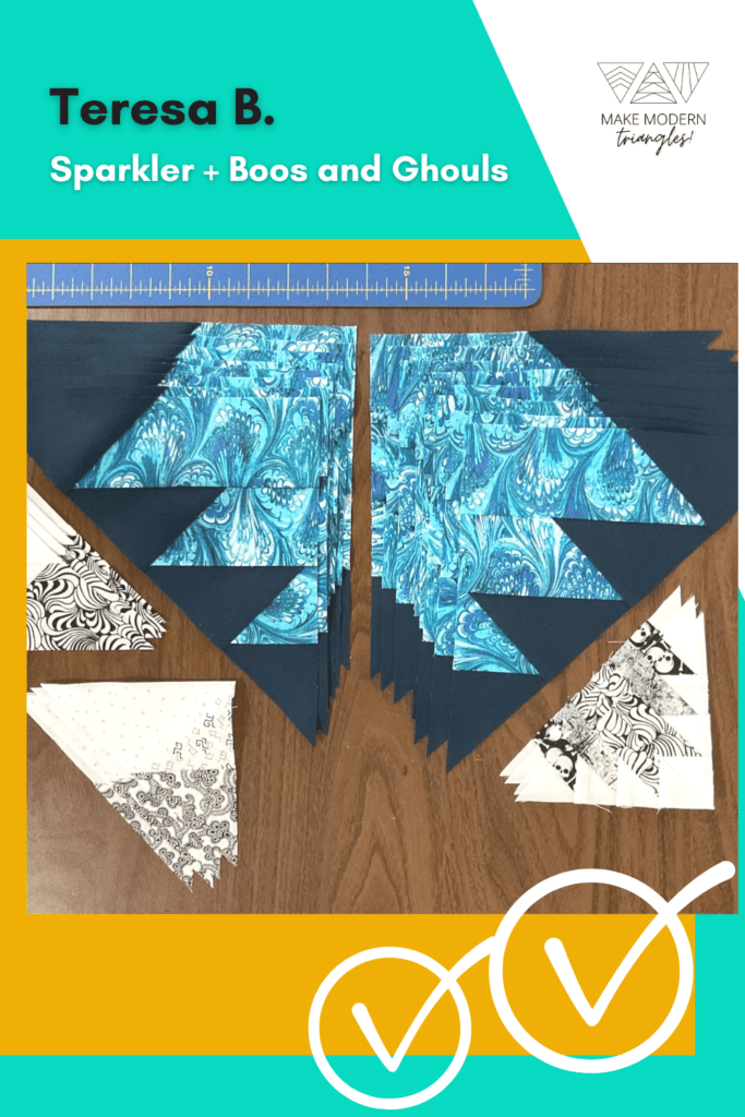 Sparkler BOM member makes by Teresa B. include modern triangles blocks in teal and blue fabrics.