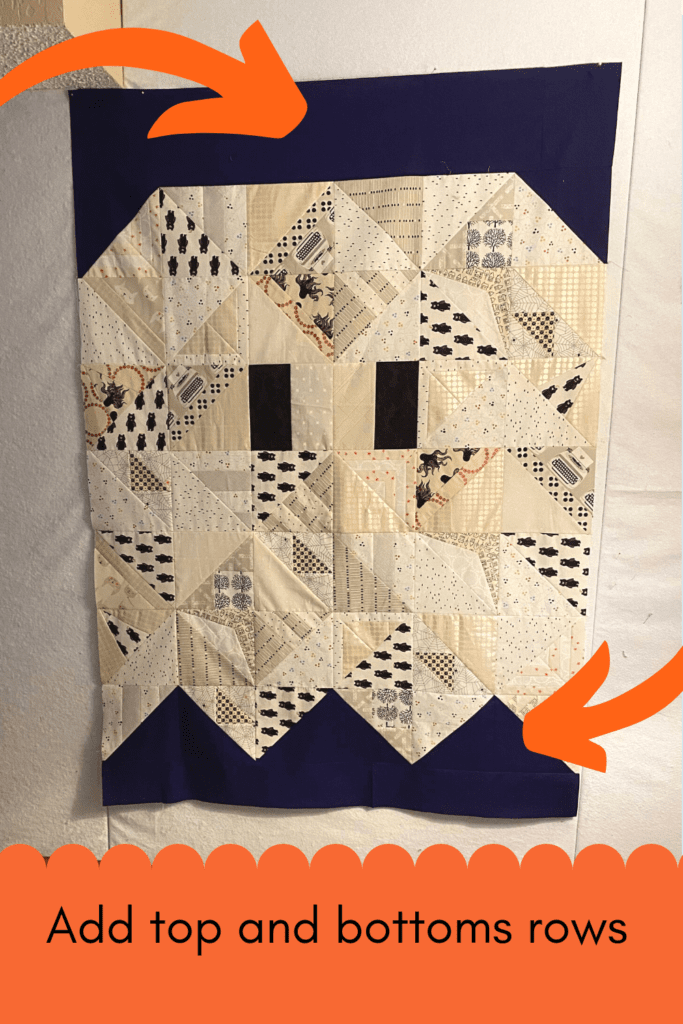 Photo of ghost quilt with top and bottom background rows added with a caption "add top and bottom rows".