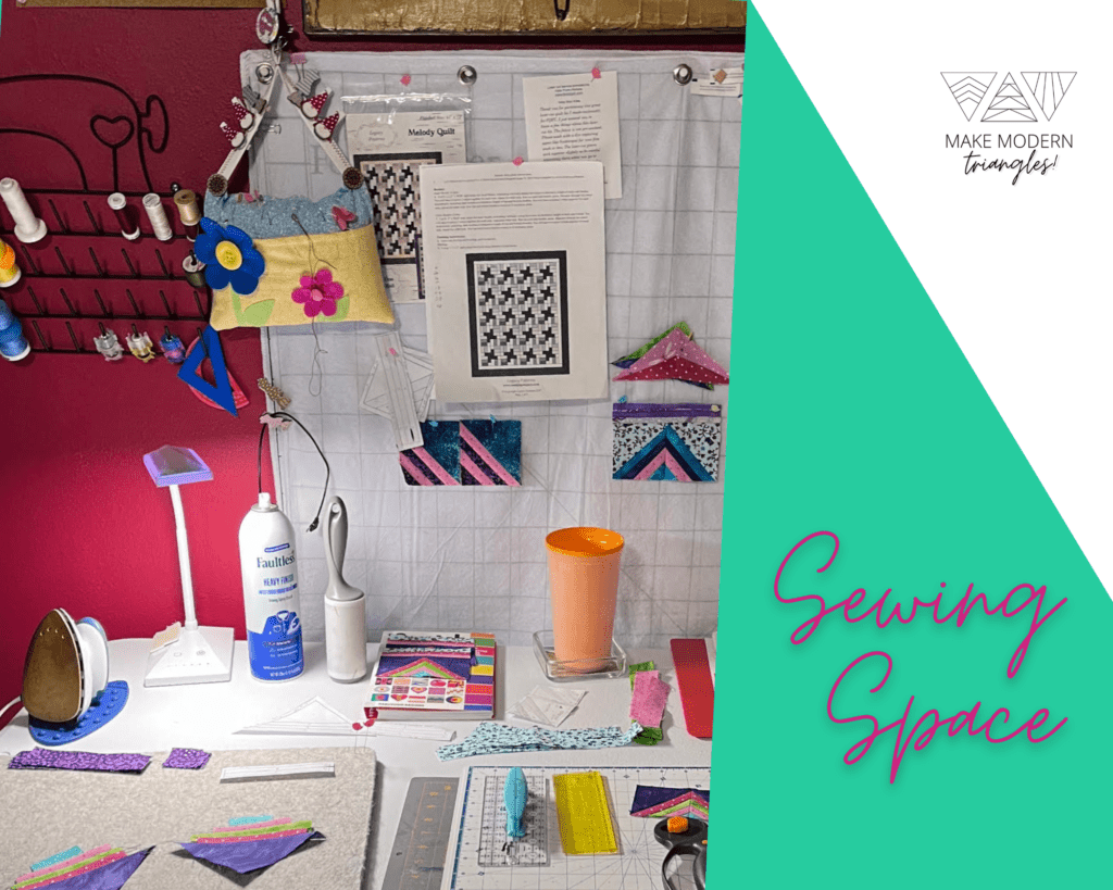 Deann's sewing space in her home with quilting tools, rulers and fabric.