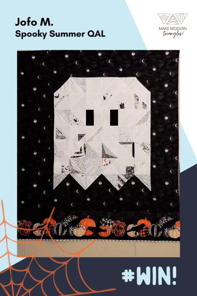 Spooky Summer Quilt Along member makes with modern triangles that make a cute ghost quilt.