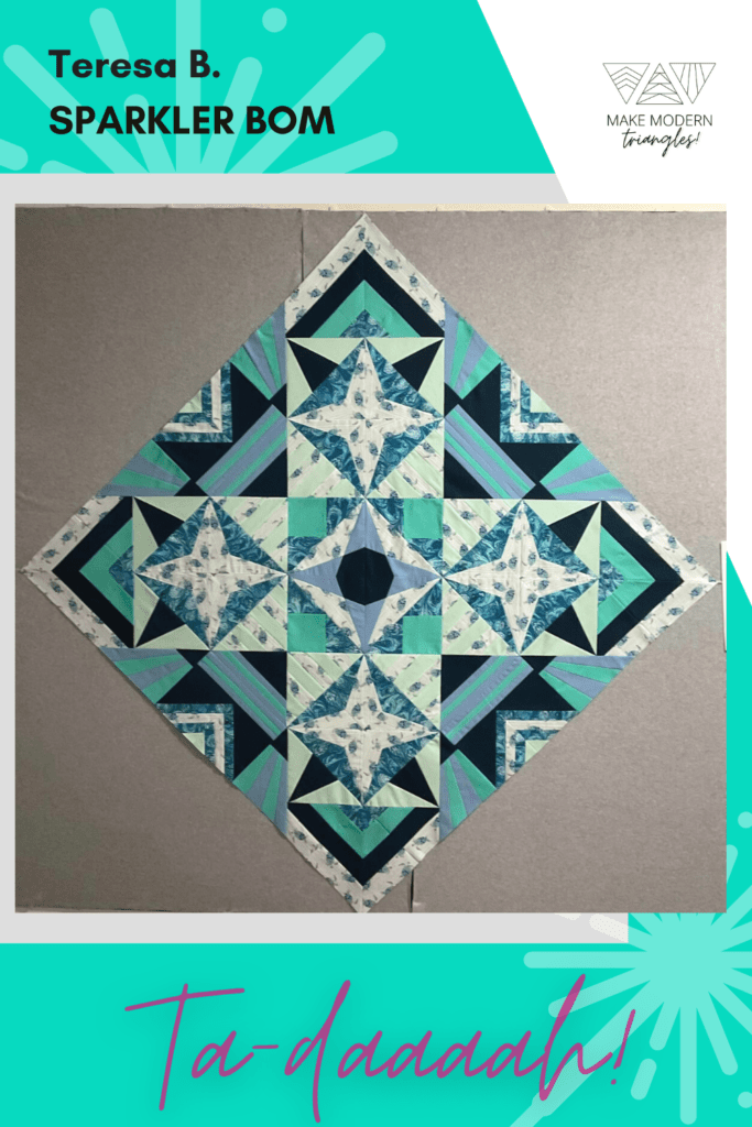 Progress on Sparkler BOM quilt by Make Modern Triangles Club member Teresa B.