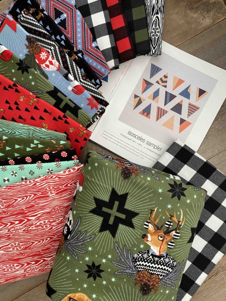 Fabrics and instructions for Merry Modern Triangles quilt along.