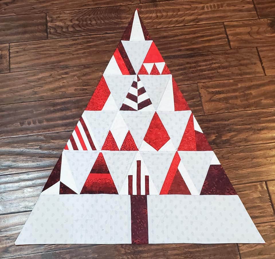 Dayna N. created a unique layout shaped as a tree in brown and red fabrics.