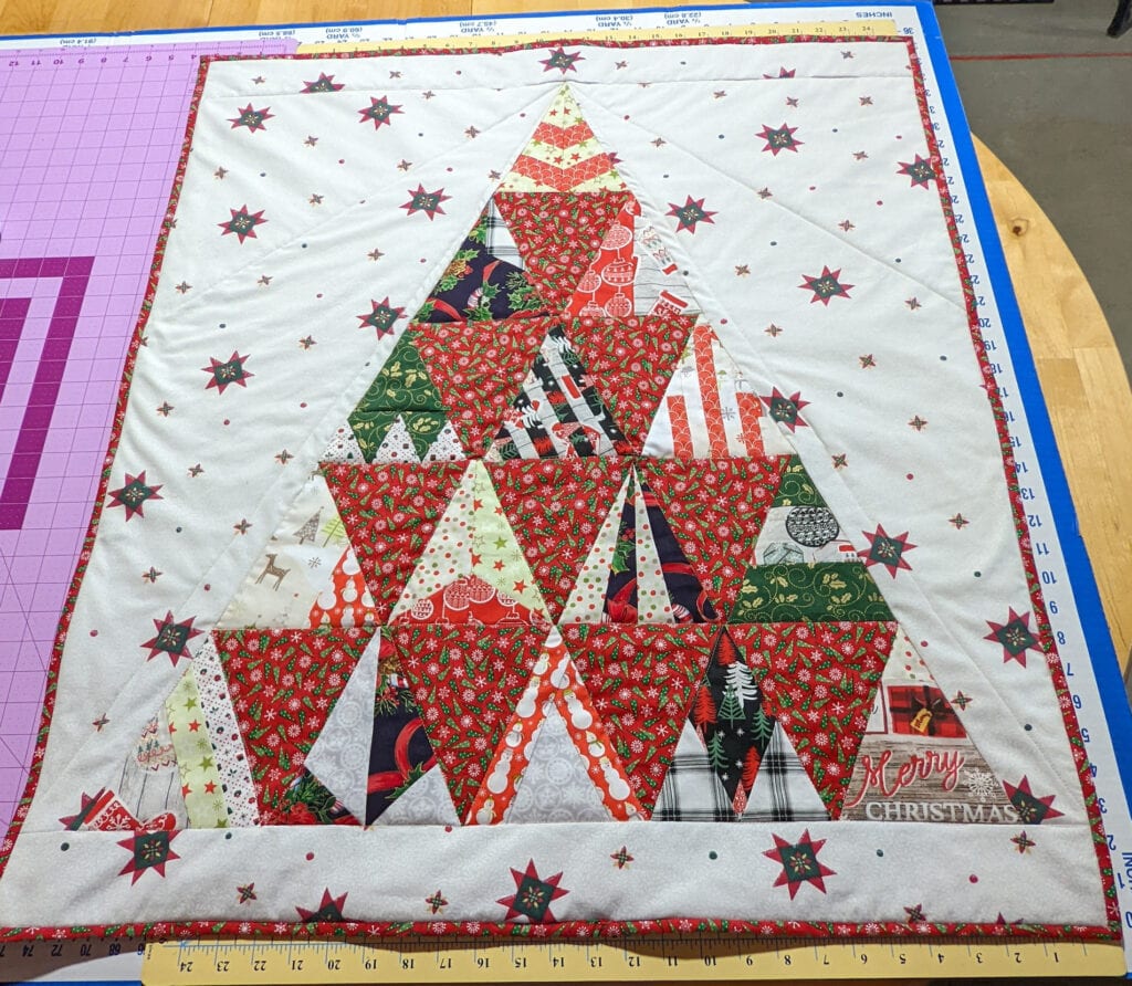 Member Julie W. used fussy cutting and freezer paper piecing to construct her quilt.