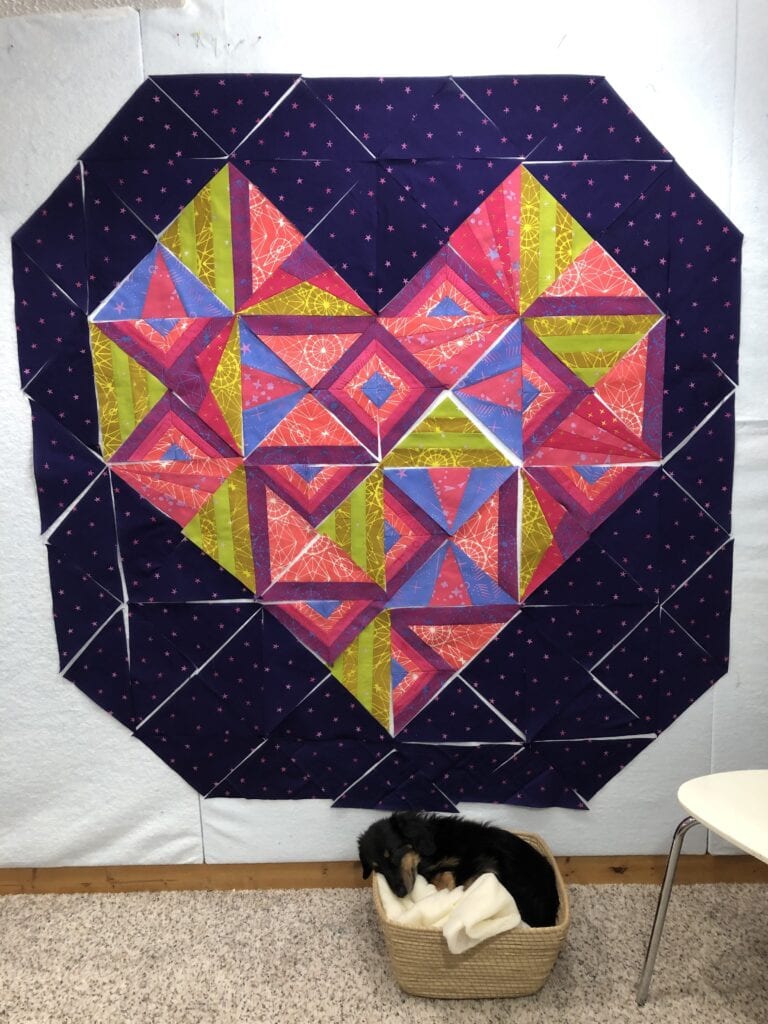 Stargazer quilt is a work in progress on the quilt design wall.