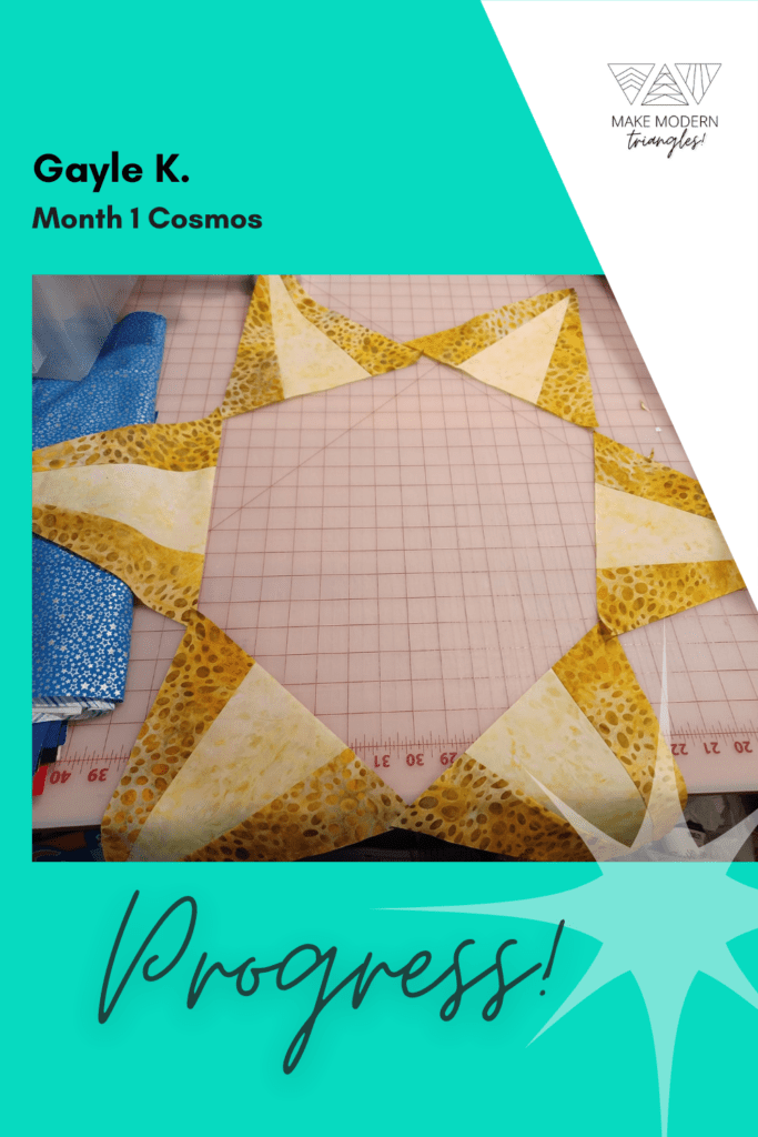 Cosmos BOM month 1 blocks completed by Make Modern Triangles member in yellow and gold fabrics.