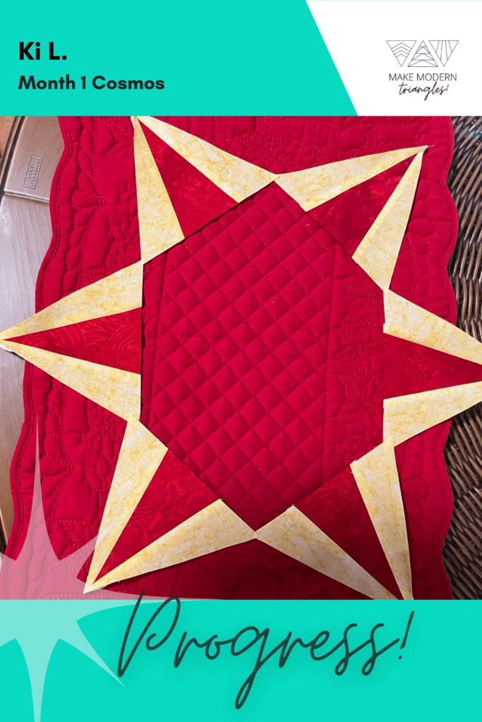 Cosmos BOM month 1 blocks completed by Make Modern Triangles member in red and yellow fabrics.