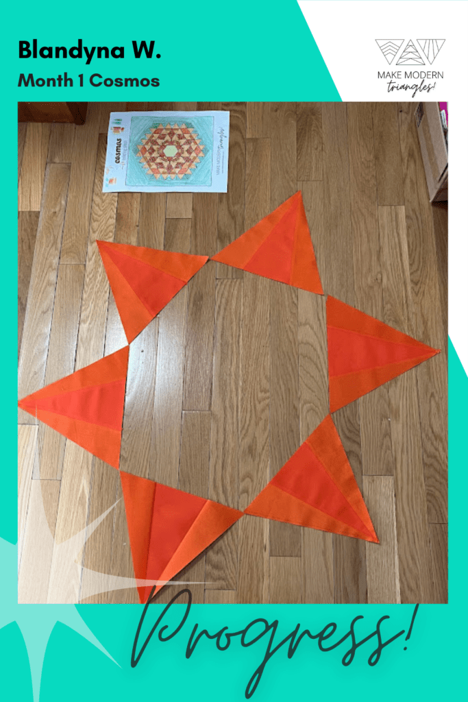 Cosmos BOM month 1 blocks completed by Make Modern Triangles member in orange fabrics.