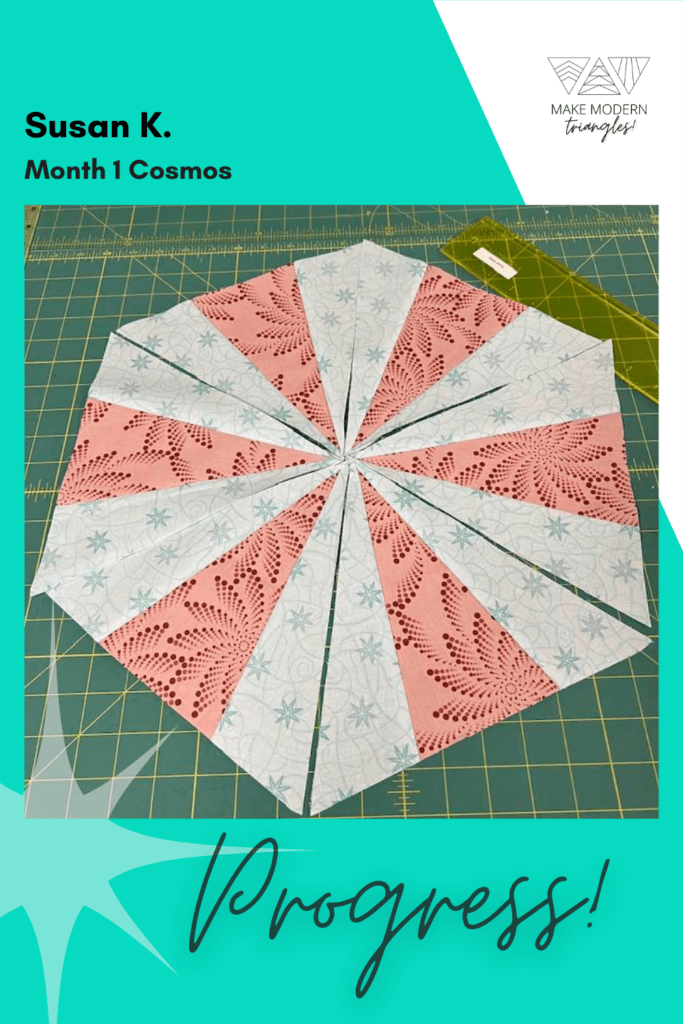 Cosmos BOM month 1 blocks completed by Make Modern Triangles member in coral and teal print fabrics.