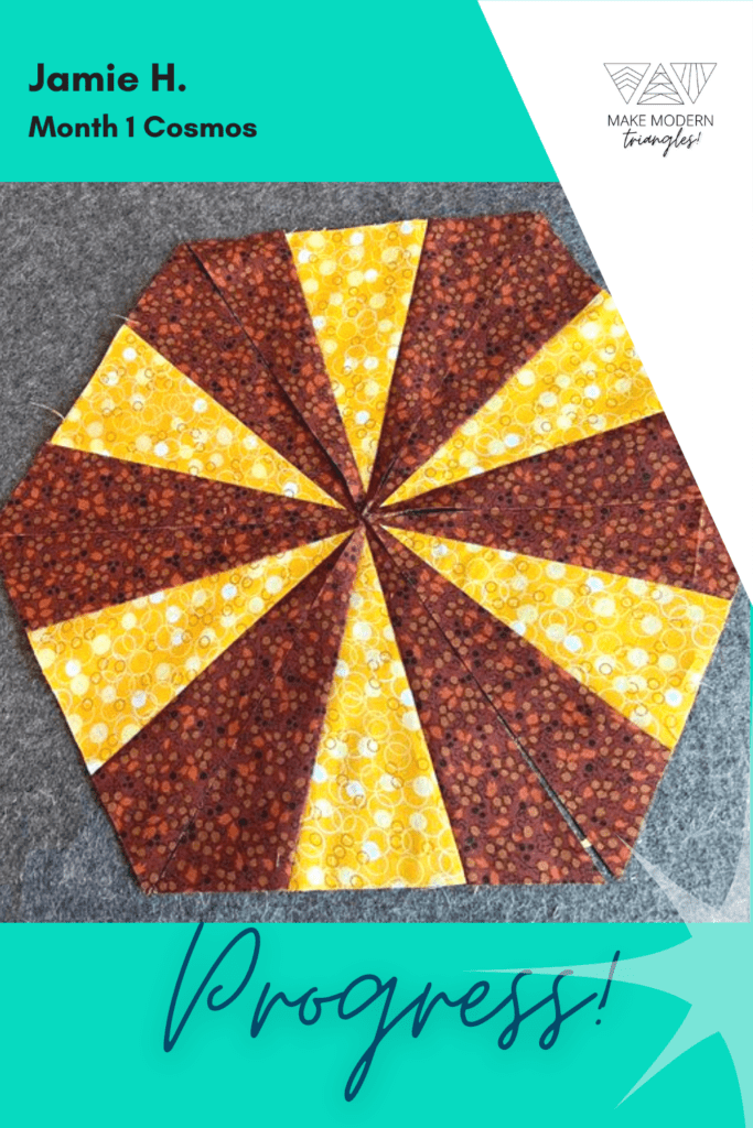 Cosmos BOM month 1 blocks completed by Make Modern Triangles member in brown and yellow print fabrics.