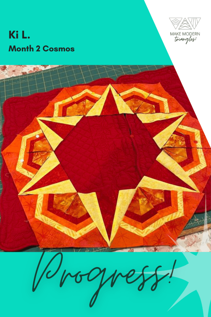 Cosmos Month 2 member make in red, yellow and orange fabrics.