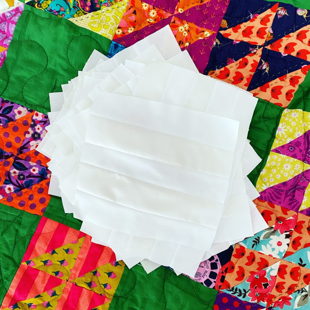 Photo shows improvisationally pieced quilt blocks by Bryan House Quilts