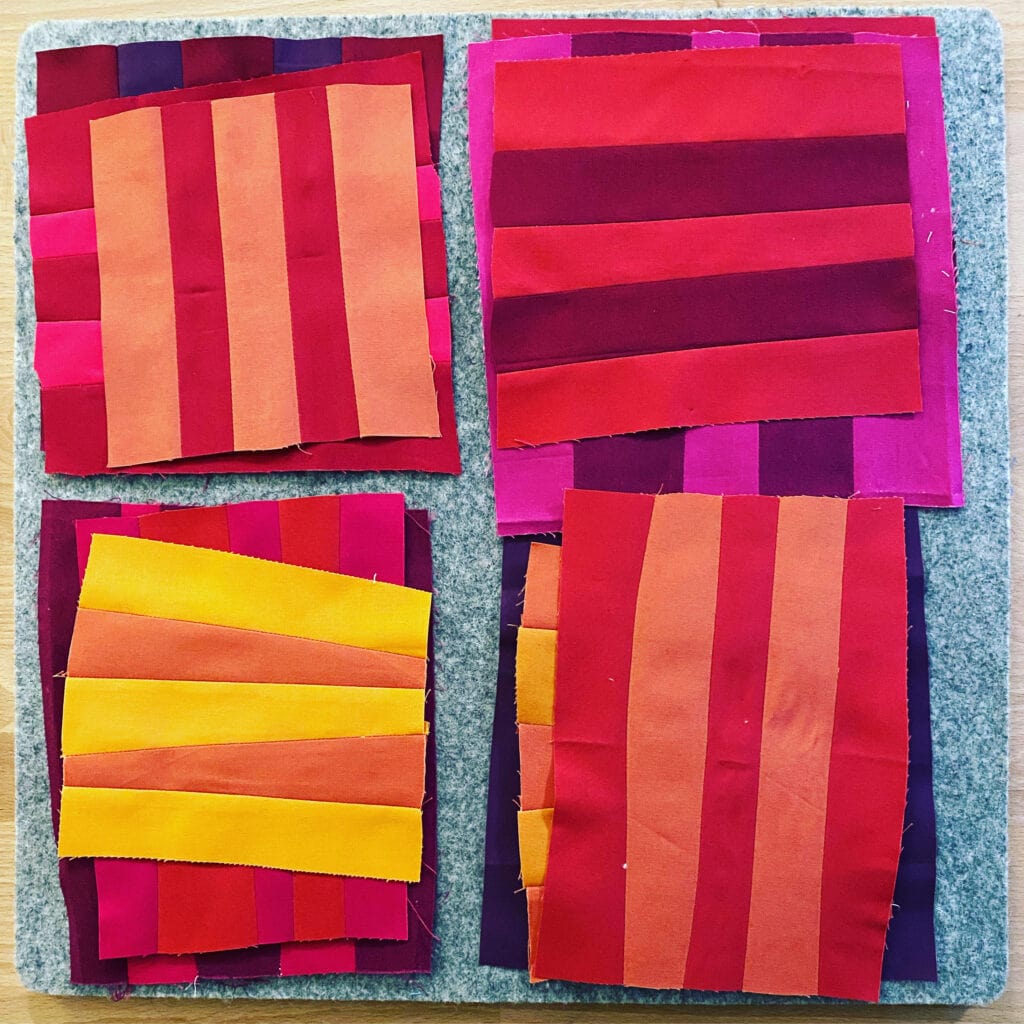 Photo shows improv quilt blocks by Bryan House Quilts