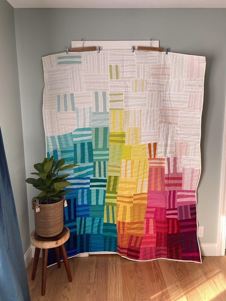 Photo shows Rainbow Remix 2.0, an improv quilt by Bryan House Quilts