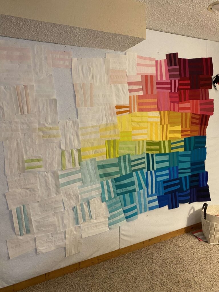 Photo shows an improvisationally pieced quilt by Bryan House Quilts