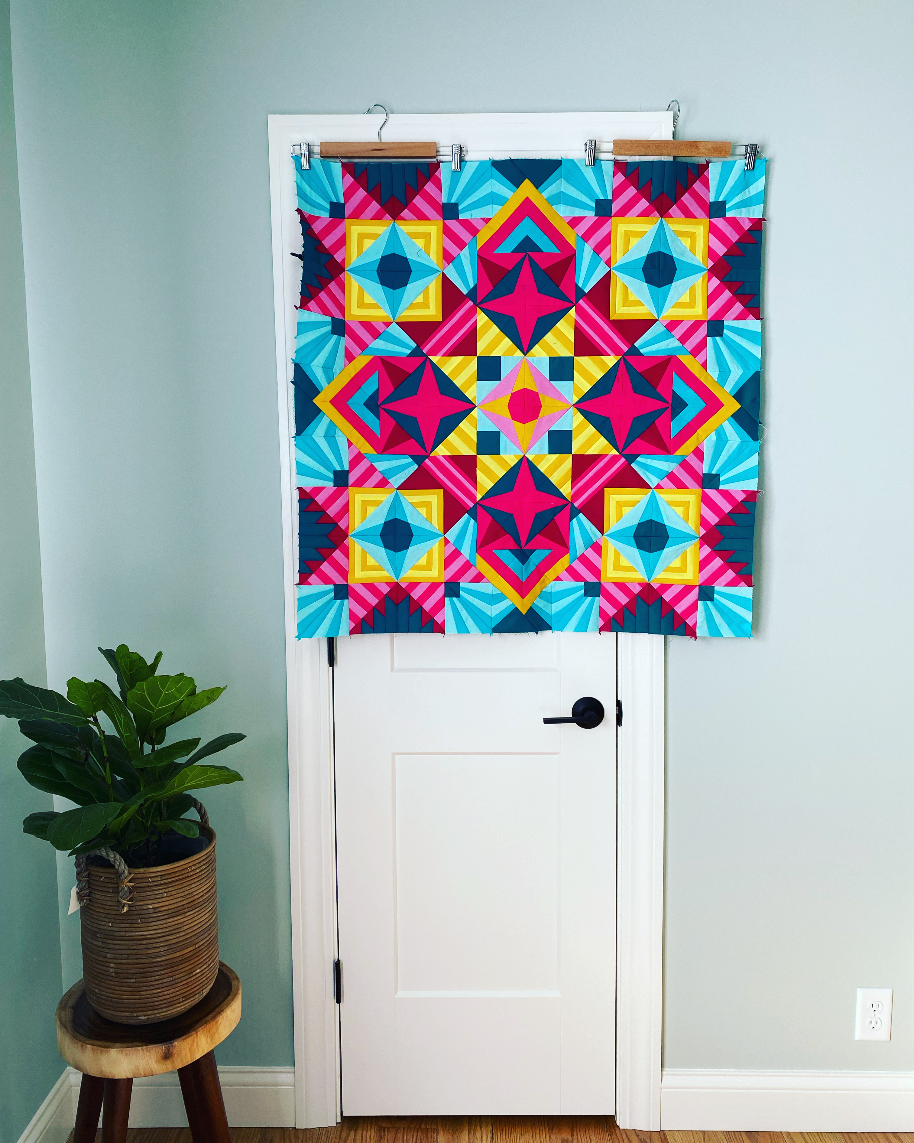 A door frame and pants hangers make a design wall