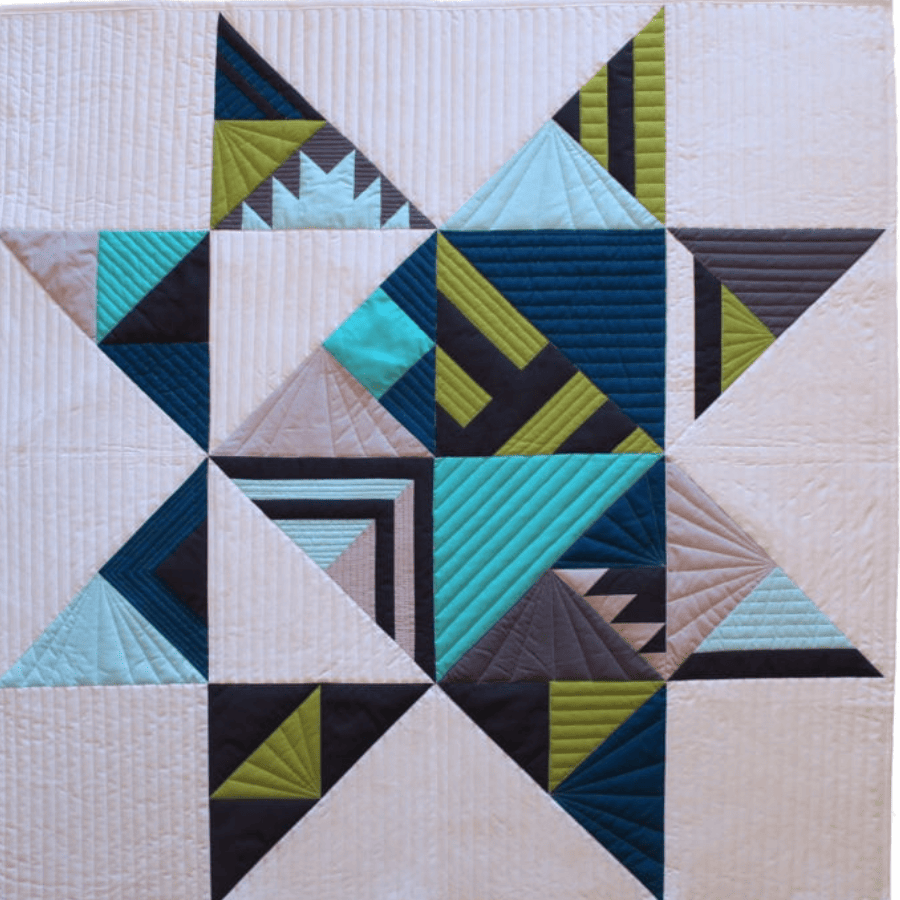 Designing quilt patterns with modern triangles using a classic quilt block 8-pointed star. .