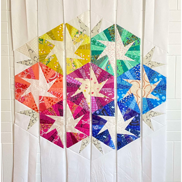 Scrappy Whirligig quilt on my quilting design wall