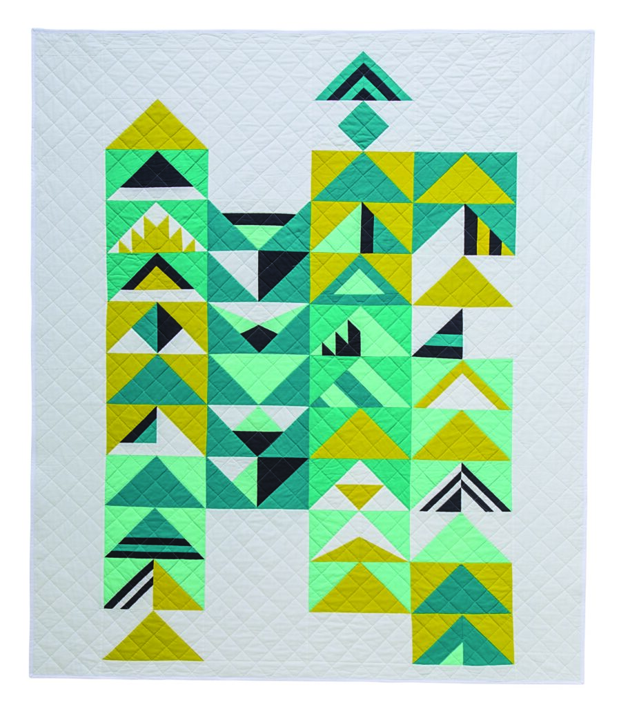 Twilight, a modern triangle quilt is an example of designing quilt patterns with classic flying geese blocks with a twist