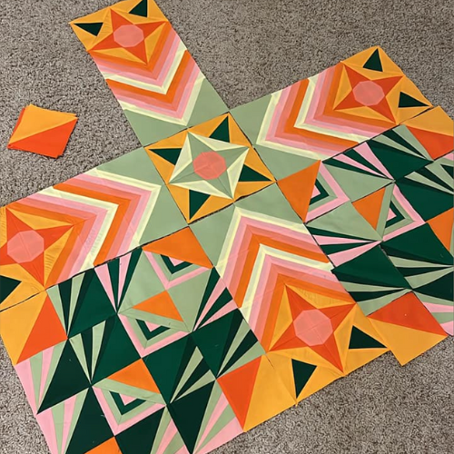 Betty Ringler's work in progress on Stargazer quilt mixing brights right