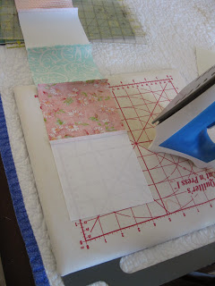 Sewing charm squares in rows