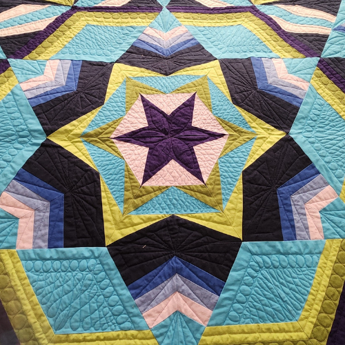 Quilt finishes by Make Modern Triangles members - Solstice by Maureen P. 