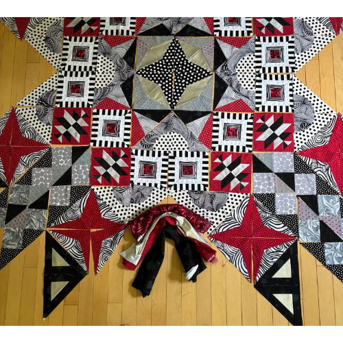 Quilt Finishes - Wendy V. made her Aurora in reds, grays, blacks and whites.