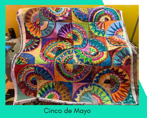 Charlotte's favorite quilt is a New York Beauty design in bright colors called Cinco de Mayo.