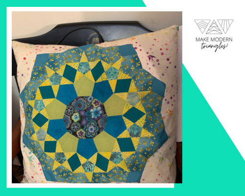 Medallion pillow in blues and gold colors