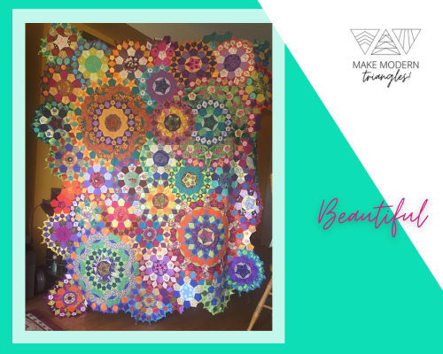 Colorful, circular blocks quilt made by Make Modern Triangles Member Spotlight #30 Charlotte C.