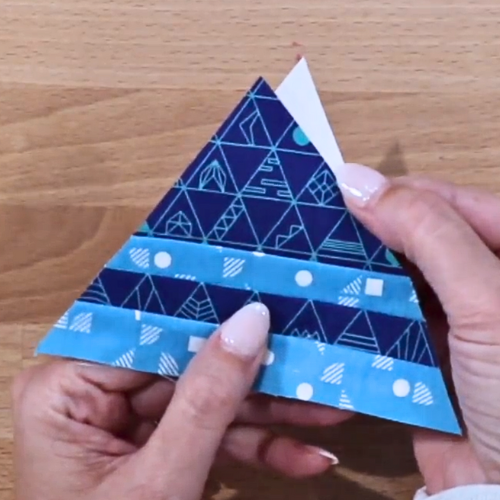 Triangle fabric shows a gap where fabric doesn't cover the foundation paper.