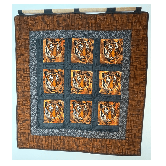 Panel quilt with tiger head print