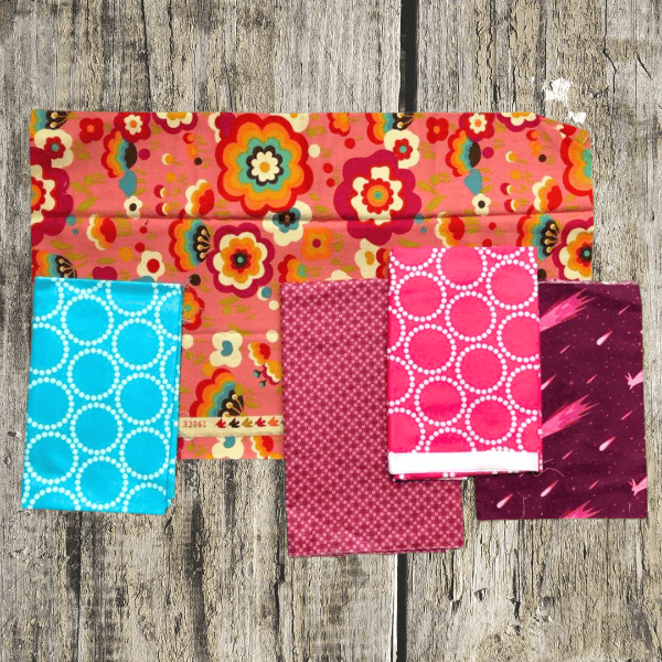 fabric swatches showing examples of contrast with color for the hello houston quilt tutorial