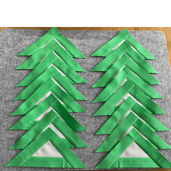 Halfway to the big finish Cathy H. shows her green and white month 4 triangle blocks