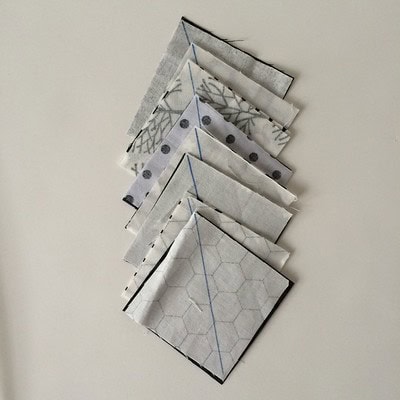 marking the squares for half square triangles for the feet