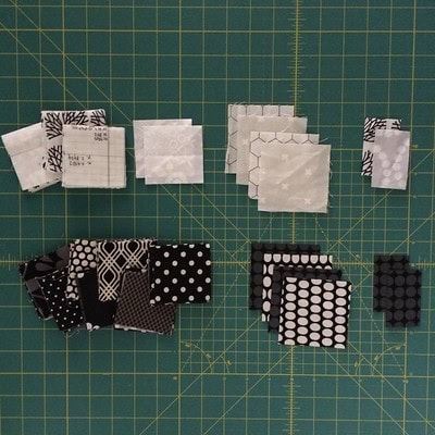 Cut fabrics and organized in piles